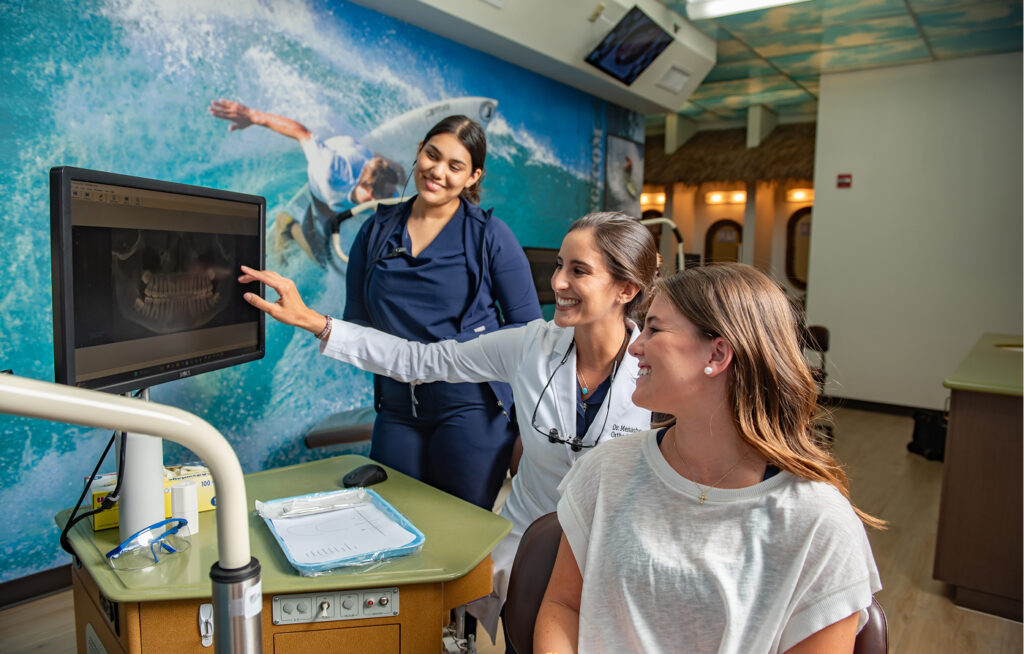 Dr. Menashe working with patients